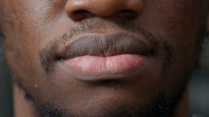 close-up of a man’s upper lip and mouth